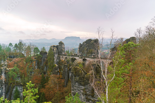 Autumn landscape overlooking forest and rocks. Czech Saxony. Cloudy day. National park.