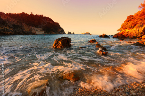 Spectacular sunset scenery, amazing view of coast in Paleokastritsa,  Ampelaky beach near Paleokastritsa monastery, and Agios Pavlos beach, Corfu island, Greece, Europe