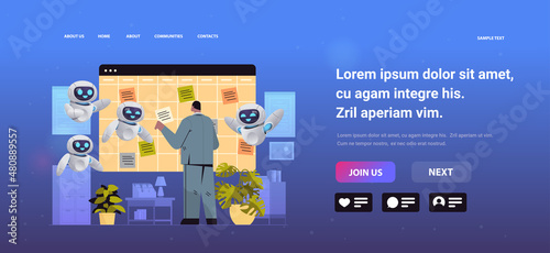 businessman with robots assistants planning day scheduling appointment agenda meeting plan time management