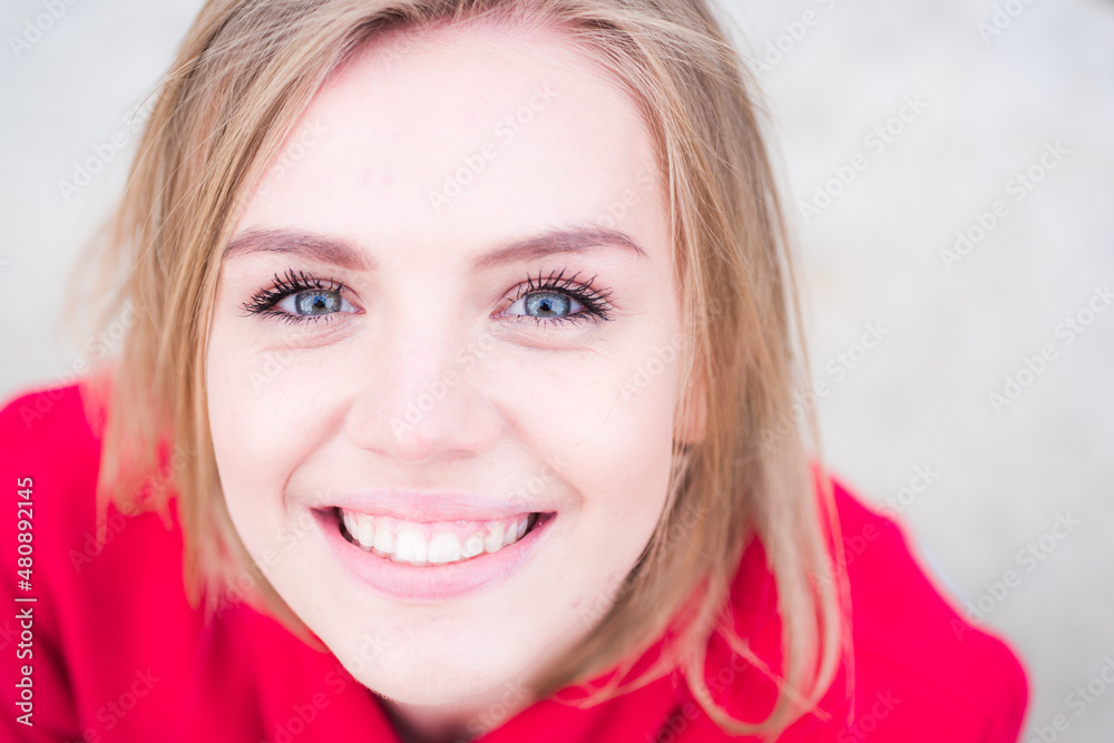Portrait of a happy smiling woman, close up face of beautiful woman outdoor. Closeup teen with romantic smile. Cheerful female model. Portrait of a happy smiling woman, close up face of beautiful woman outdoor. Closeup teen with romantic smile. Cheerful female model.