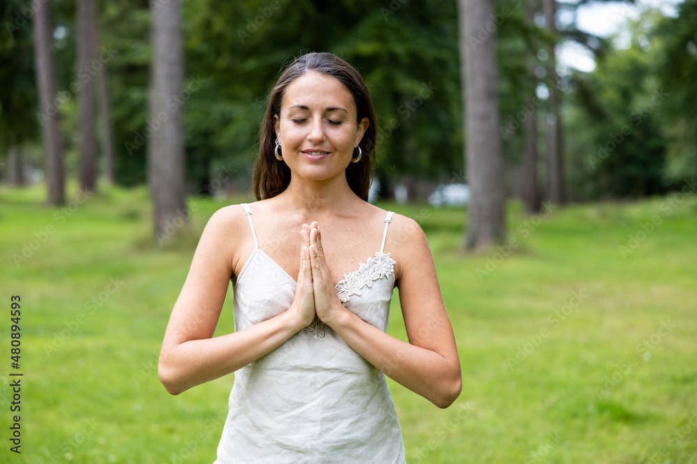 Smiling woman practicing yoga at Cannock Chase Smiling woman practicing yoga at Cannock Chase