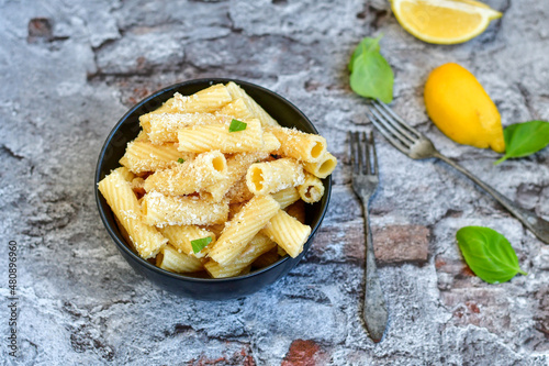  Italian home made rigatoni pasta with tuna fish, parmesan cheese and black pepper .
