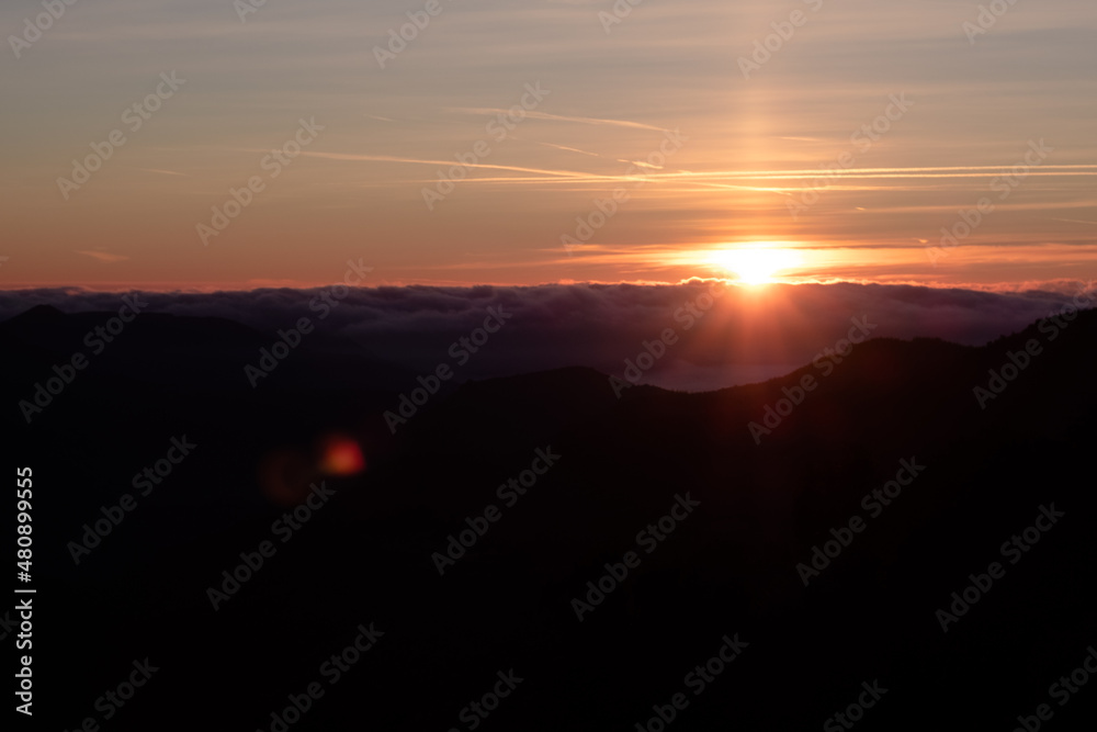 Bright Sun shining over the clouds on a mountain landscape in Montseny, Catalonia