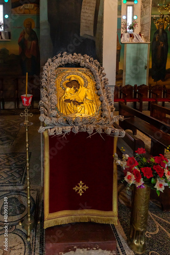 Gilded icon depicting the Mother of God with a baby in her hands in the Monastery Deir Hijleh - Monastery of Gerasim of Jordan, in the Palestinian Authority, in Israel photo