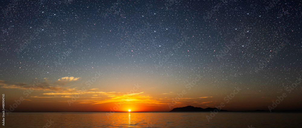 a sunrise at sea with beautiful gradient and stars