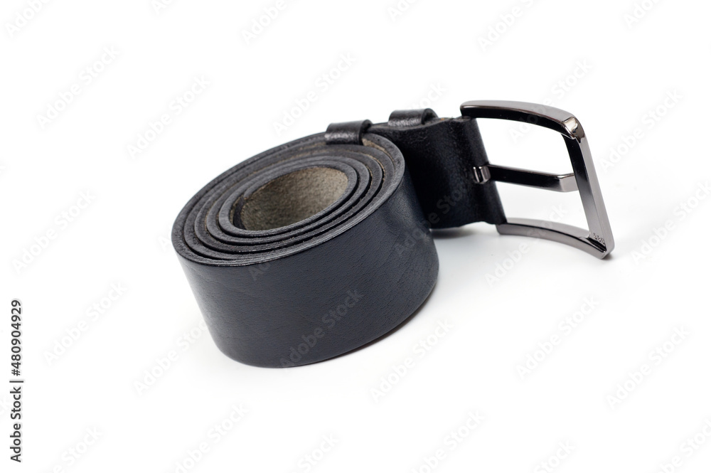 Black leather belt with a classic metal buckle for men's trousers and jeans. Black leather belt with a classic metal buckle for men's trousers and jeans.