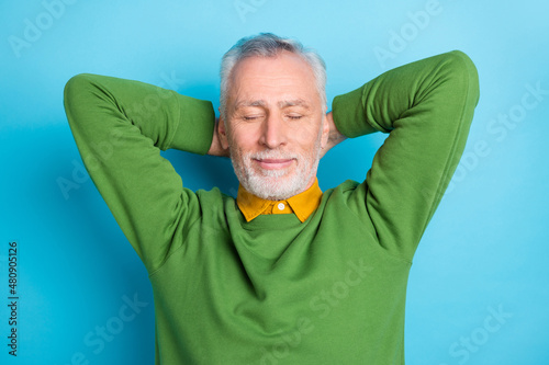 Photo of pretty dreamy retired man wear green sweater closed eyes arms behind he Poster Mural XXL