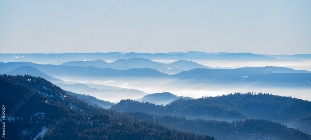 Amazing mystical rising fog mountains sky forest trees landscape view in black forest ( Schwarzwald ) winter, Germany panorama panoramic banner - mystical snow foggy mood