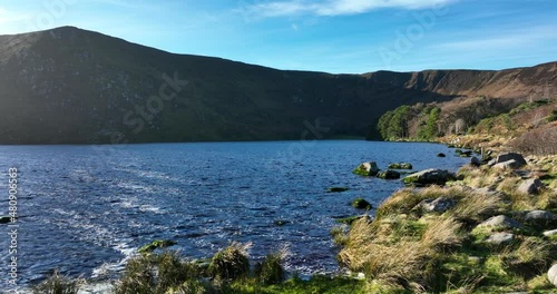 Lough Bray, Wicklow, Ireland. January 2022 Drone tracks south along the eastern shore of the lower lake with the Eagles Crag lookout point and Kippure mountain in the background. photo