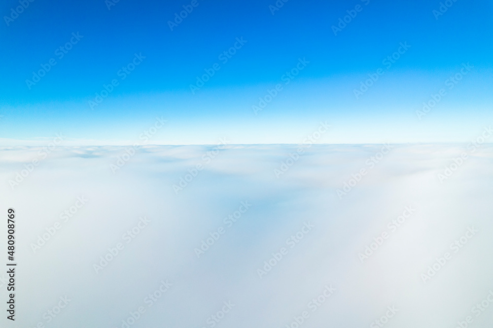 Clear Blue Sky Over Clouds Level. Aerial Drone View Clear Blue Sky Over Clouds Level. Aerial Drone View