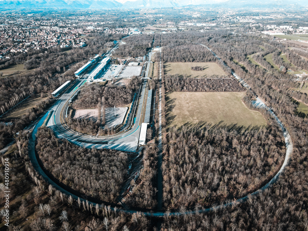 Fototapeta premium Aerial view of The Autodromo Nazionale of Monza, that is a race track located near the city of Monza, north of Milan, in Italy. Drone photography of the circuit in Monza, Lombardia, Brianza.