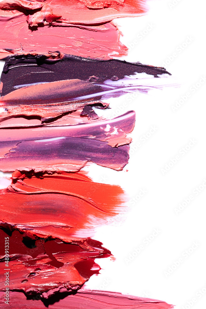 Few lipsticks smear on white background Few lipsticks smear on white background