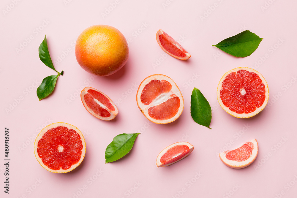 fresh Fruit grapefruit with Juicy grapefruit slices on colored background. Top view. Copy Space. creative summer concept. Half of citrus in minimal flat lay with copy space fresh Fruit grapefruit with Juicy grapefruit slices on colored background. Top view. Copy Space. creative summer concept. Half of citrus in minimal flat lay with copy space