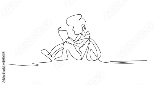 little boy reading a book sitting on the floor drawing concept
