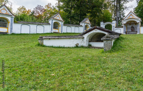 Courtyard with the Passion of Jesus in the forest on a mountain in the Alps photo