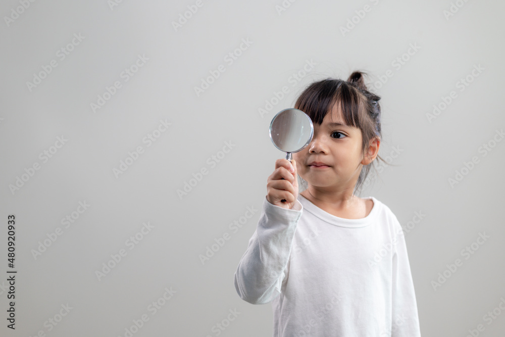 little girl looking through a magnifying glass little girl looking through a magnifying glass