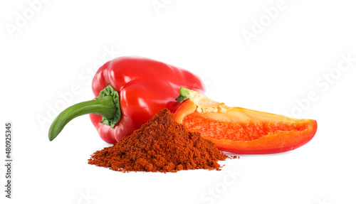 Fresh bell peppers and paprika powder on white background