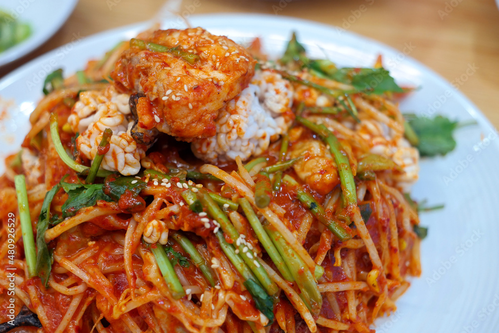 Korean steamed angler fish with plenty of bean sprouts and spicy seasoning Korean steamed angler fish with plenty of bean sprouts and spicy seasoning