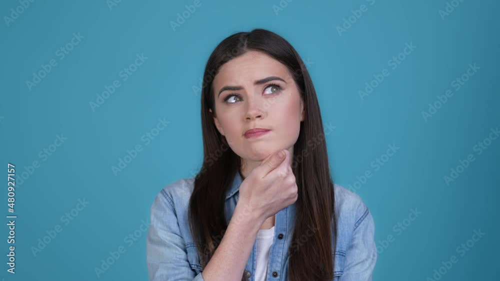 Lady have thoughts question amazed genius isolated blue color background Lady have thoughts question amazed genius isolated blue color background