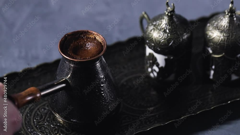 Making Turkish coffee in copper cezve Making Turkish coffee in copper cezve