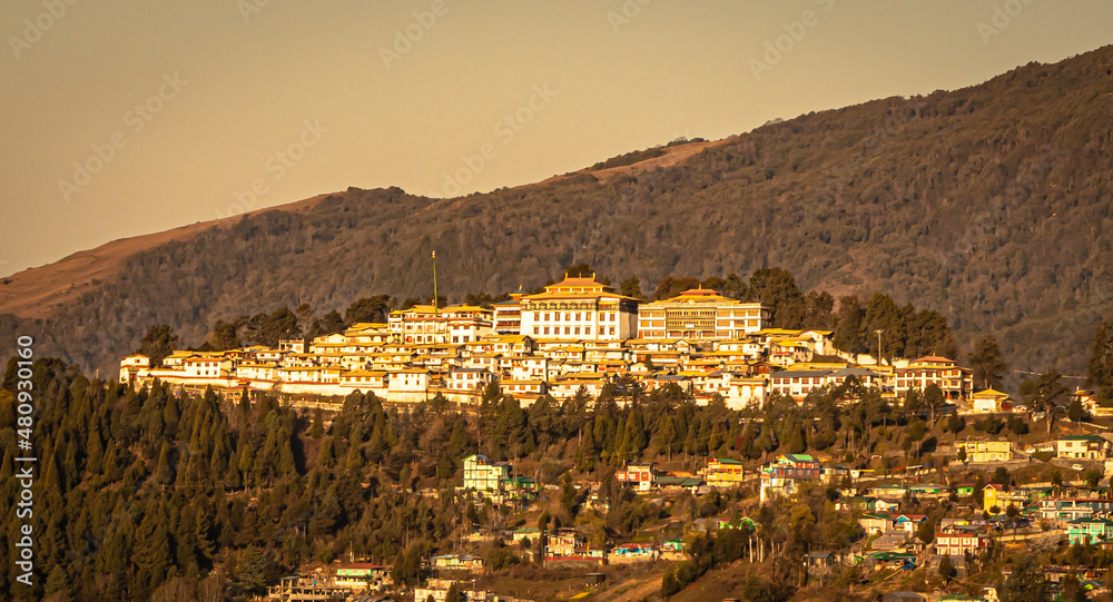 tawang city view with orange sky from hill top at evening