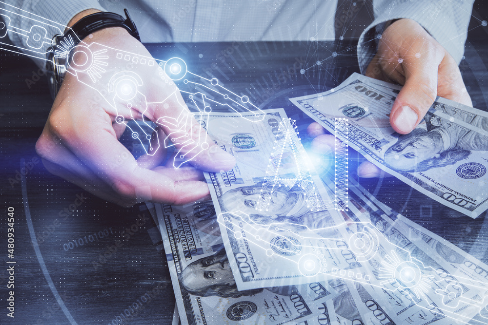 Double exposure of technology drawing hologram and us dollars bills and man hands. Data concept Double exposure of technology drawing hologram and us dollars bills and man hands. Data concept