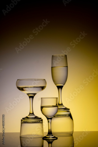 Glassware of different sizes against colorful background