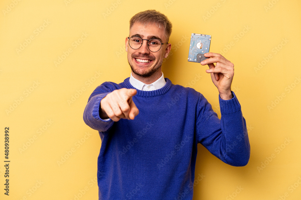 Young computer man isolated on yellow background Young computer man isolated on yellow background