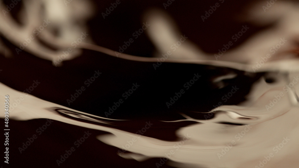 Fototapeta premium Detail of splashing melted chocolate.