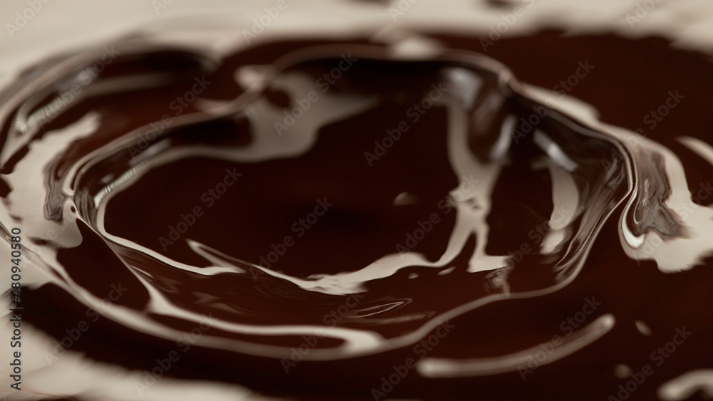 Detail of splashing melted chocolate. Detail of splashing melted chocolate.