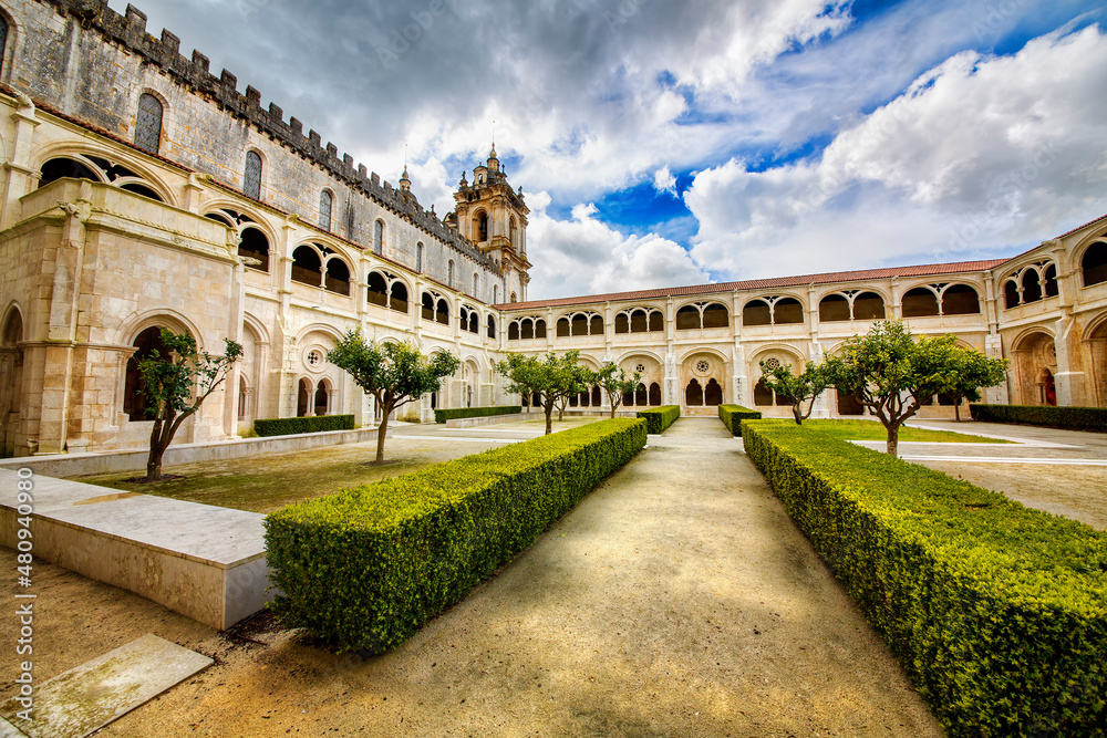 Obraz premium Cloister and Church Tower of the Alcobaca Monastery (Mosteiro de Santa Maria de Alcobaca), Portugal