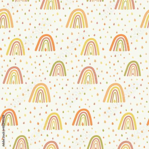 Rainbows and  raindrops seamless pattern in orange and yellow  . Great for baby cloths, Nursery , textile, baby shower and gift wrapping paper 