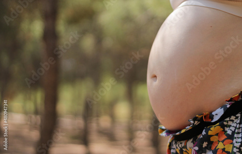Belly button of a pregnant woman