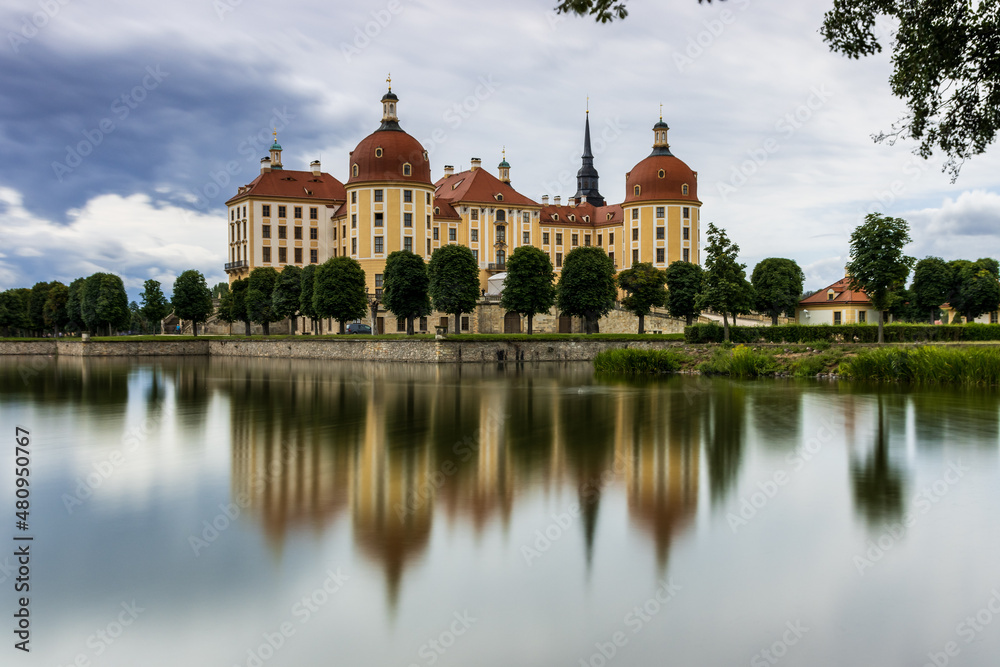 Moritzburg Castle is reflected in the lake