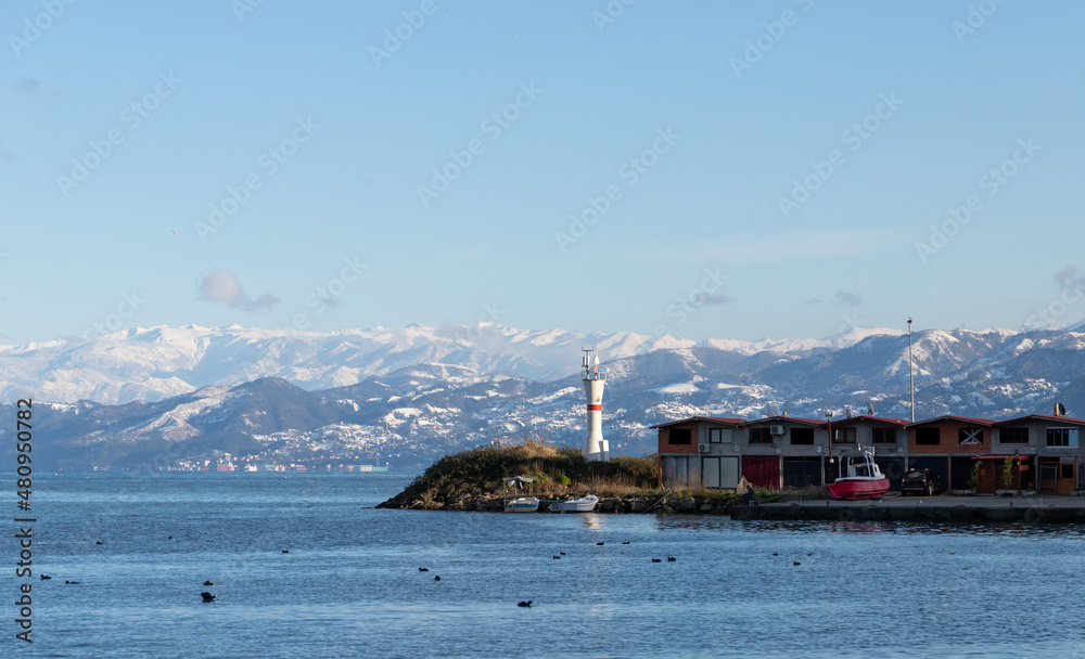 Coastal view with white beacon tower, Turkey