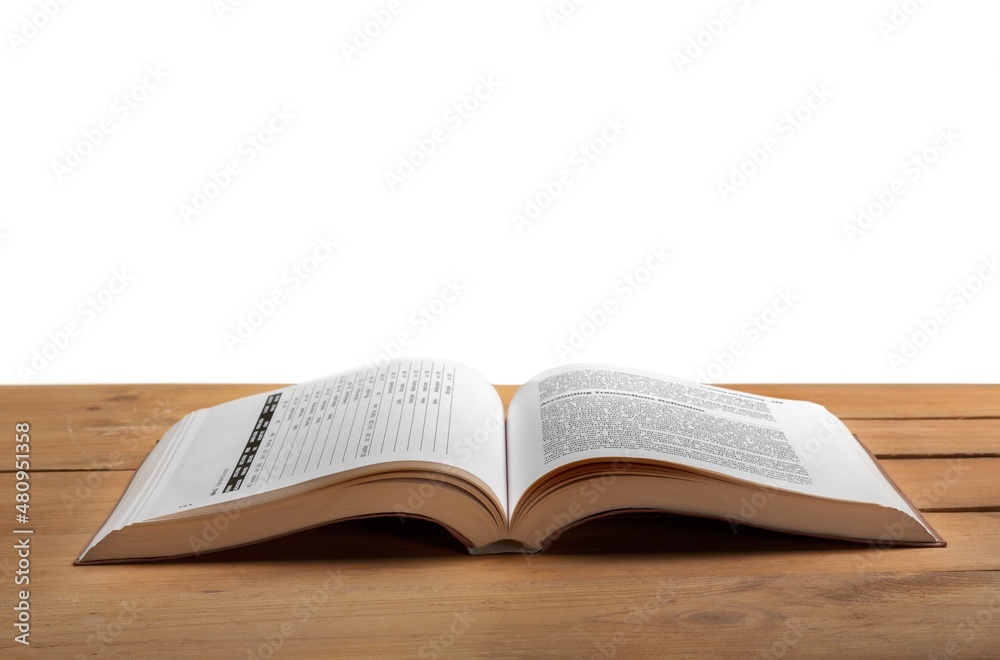 Open reading book on a wooden desk