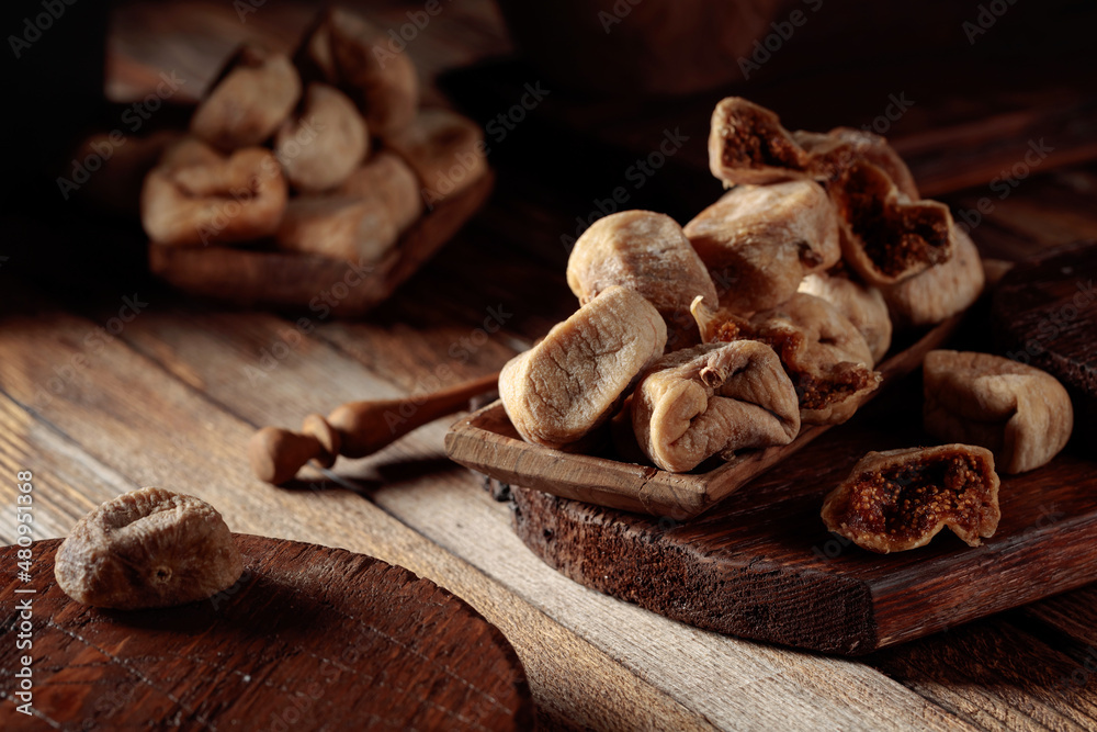 Dried figs on a old wooden table. Dried figs on a old wooden table.