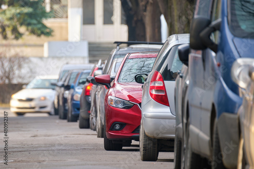 City traffic with cars parked in line on street side © bilanol