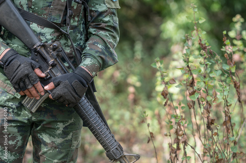 close up soldiers with gun.