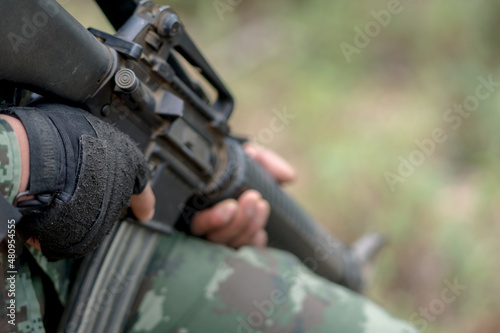 close up soldiers with gun.
