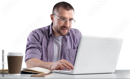 Portrait of handsome young man programmer with laptop