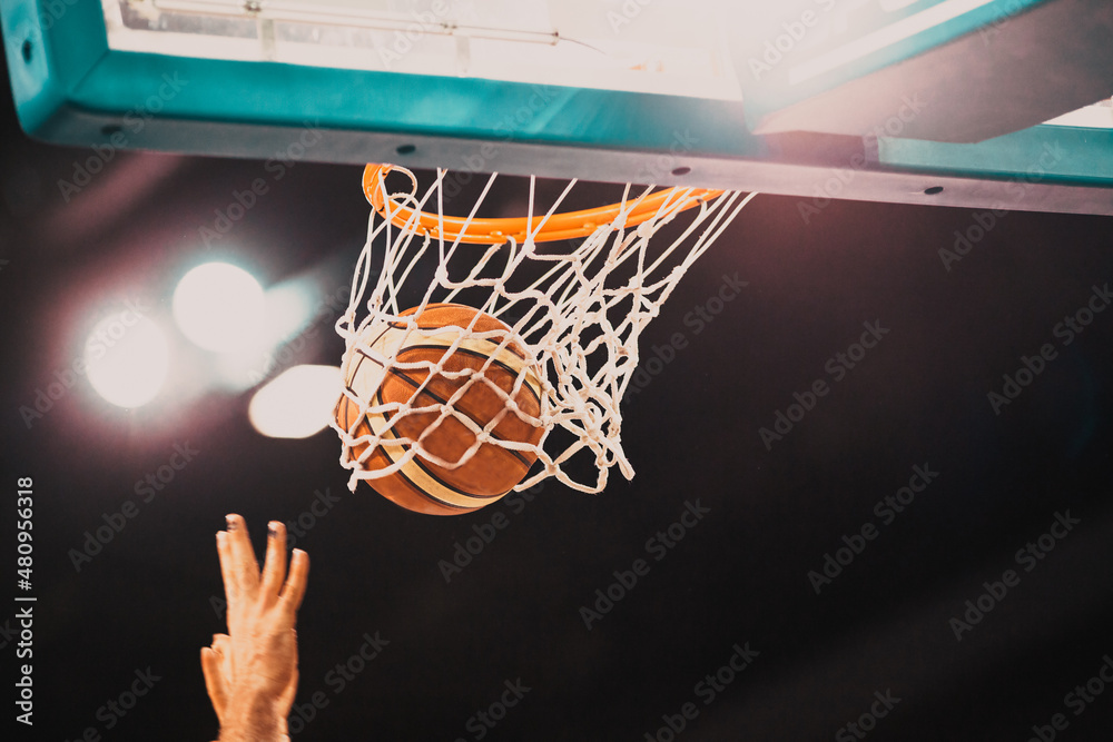 basketball game ball in hoop