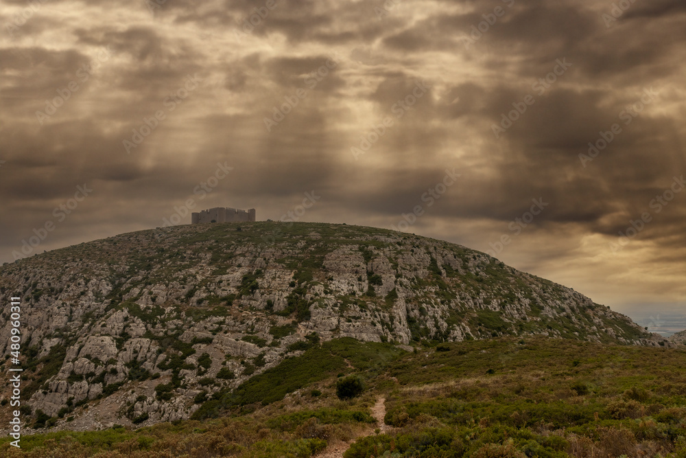 montgri castle on the costa brava in the north of spain a cloudy day