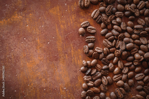 Roasted coffee beans on brown cement background