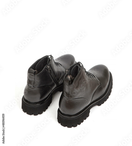 Men black winter leather boots with fur inside isolated on white background