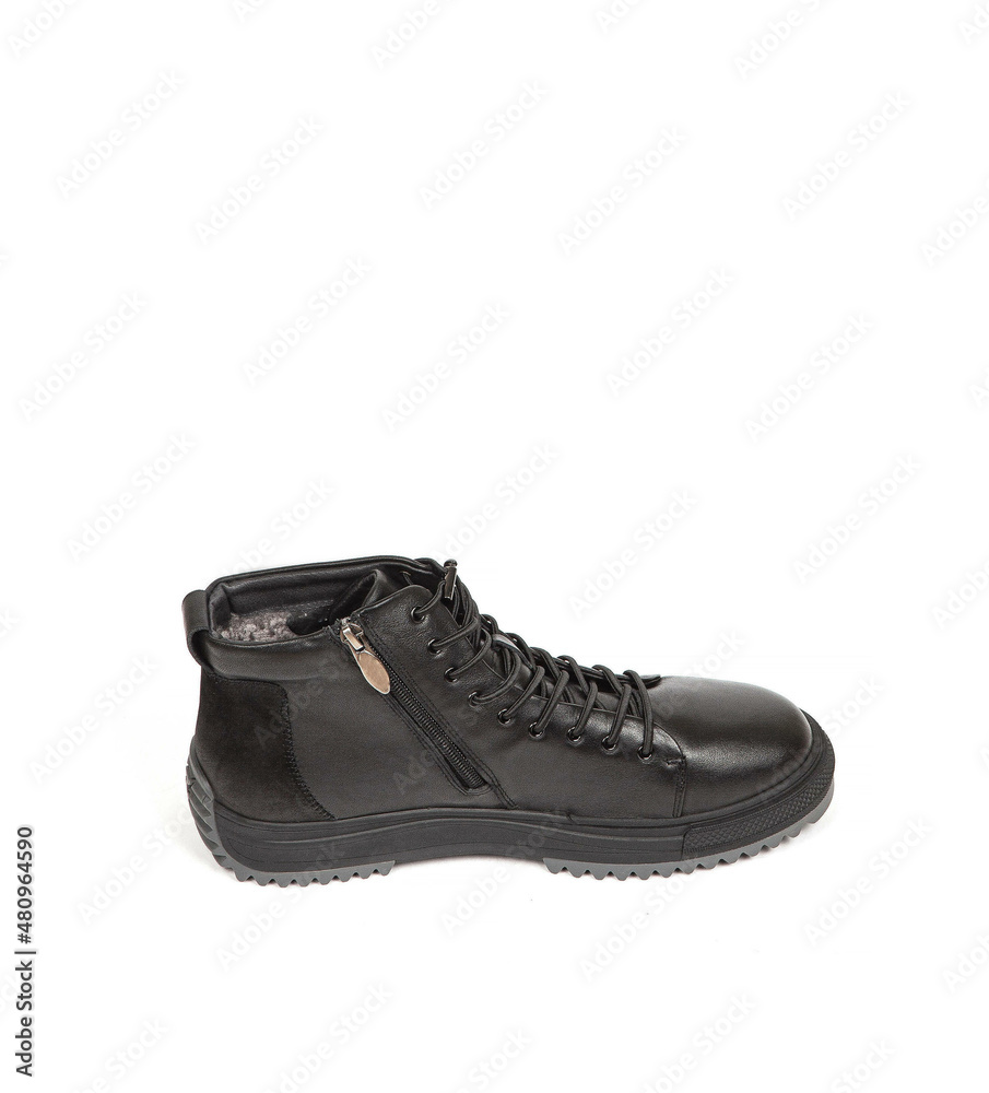 Men black winter leather boots with fur inside isolated on white background Men black winter leather boots with fur inside isolated on white background