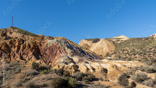 landscape view of colorful earthen hillside in an abandonend mine