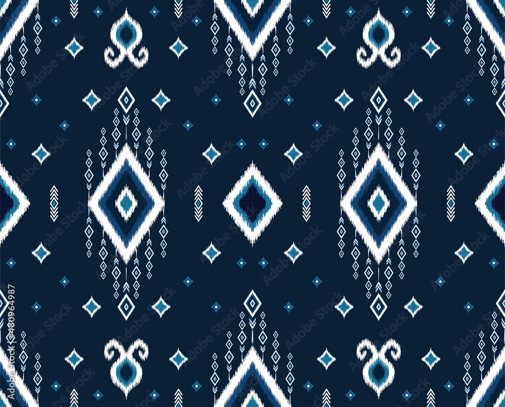 Obraz premium Ethnic blue ikat tribal seamless pattern. geometric folklore ornament. design for background,wallpaper,fabric,carpet,clothing,wrapping,batik. vector illustration in embroidery style.