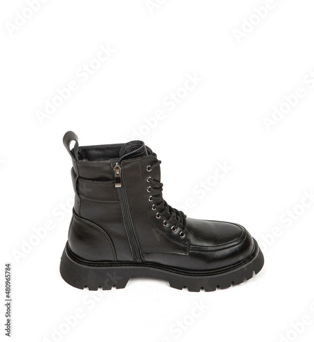 Woman's leather warm winter boots over white background