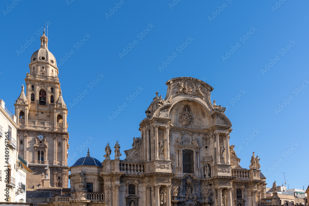 close up view of the historic cathedral in Murcia under a cloudless blue sky